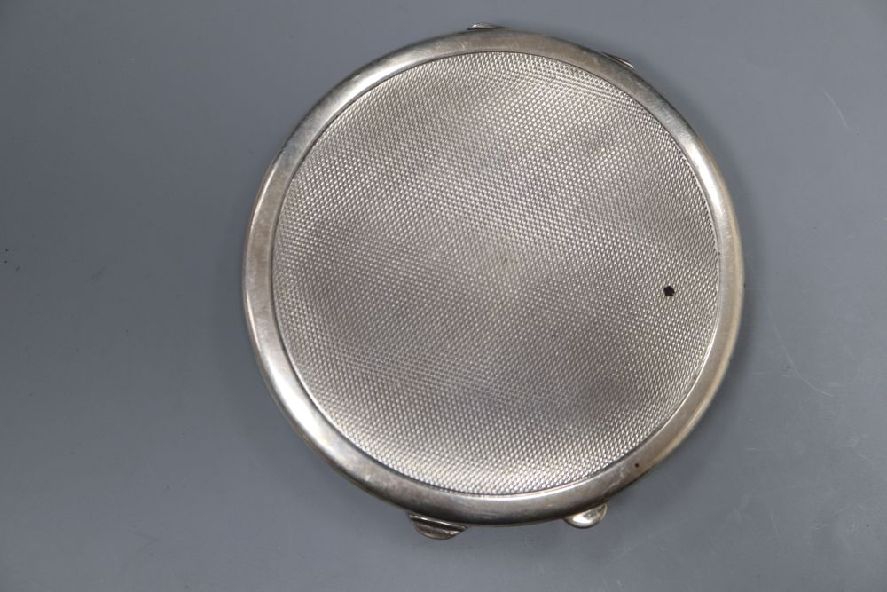 A 1950s silver and green guilloche enamel circular compact, 85mm Birmingham, 1950.